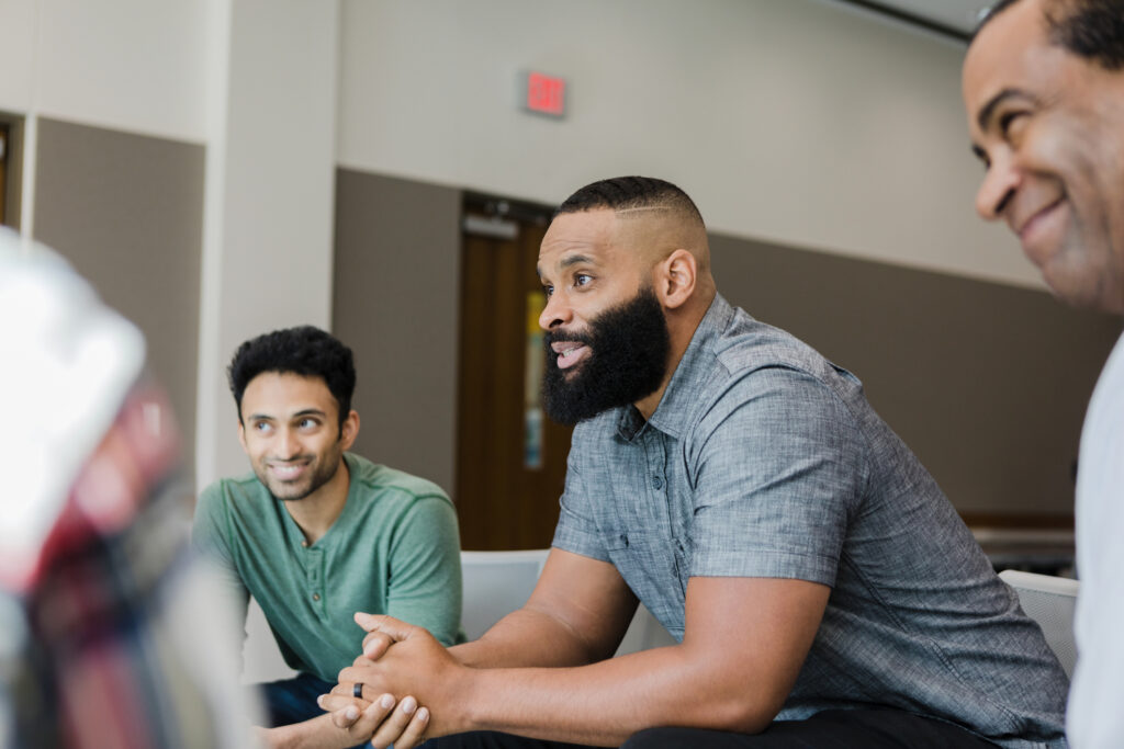 Diverse smile during support group meeting