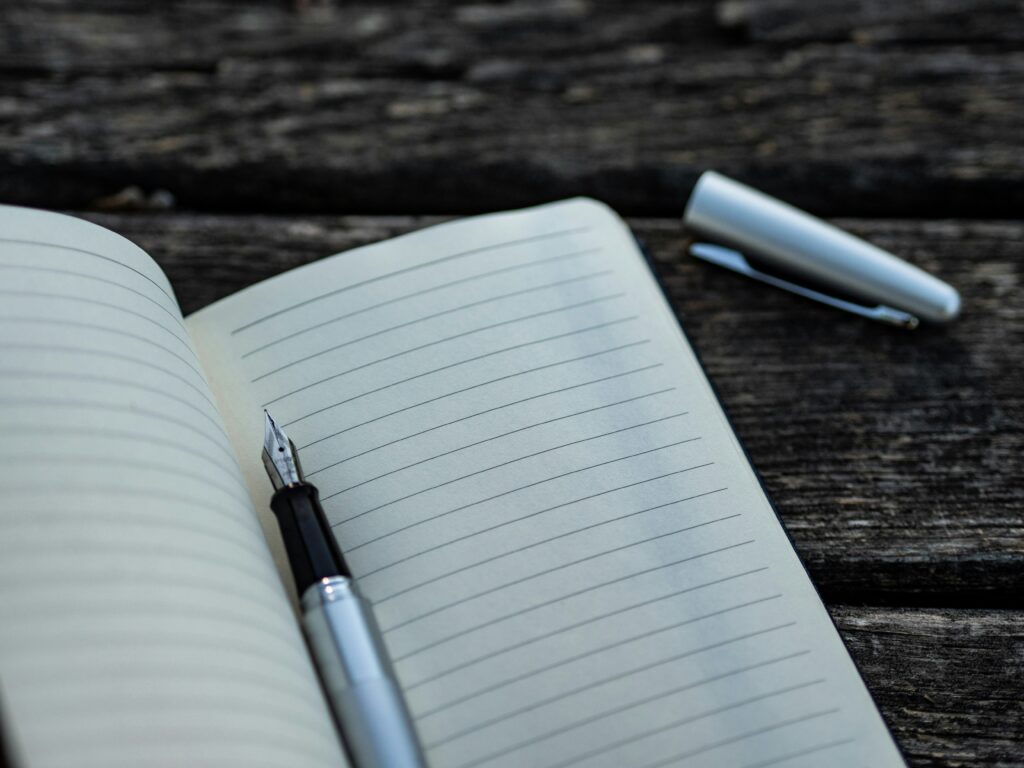Open notebook with pen